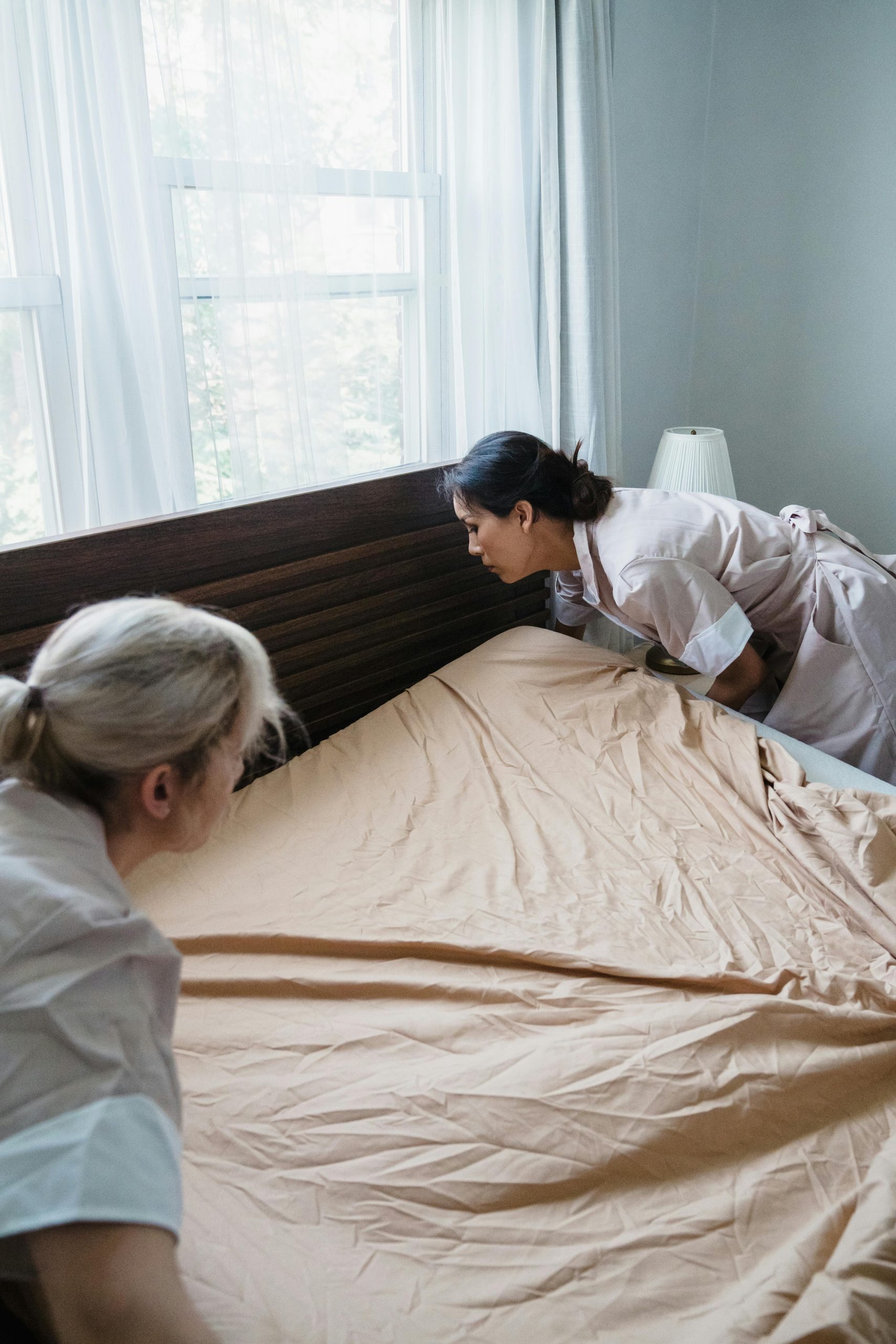 Photo by Liliana Drew: https://www.pexels.com/photo/hotel-maids-changing-bed-sheets-9462733/